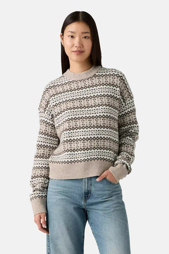 Multikleurige trui met ronde hals van Levi's®, met een geometrisch patroon en lange mouwen, gecombineerd met een jeansbroek.
