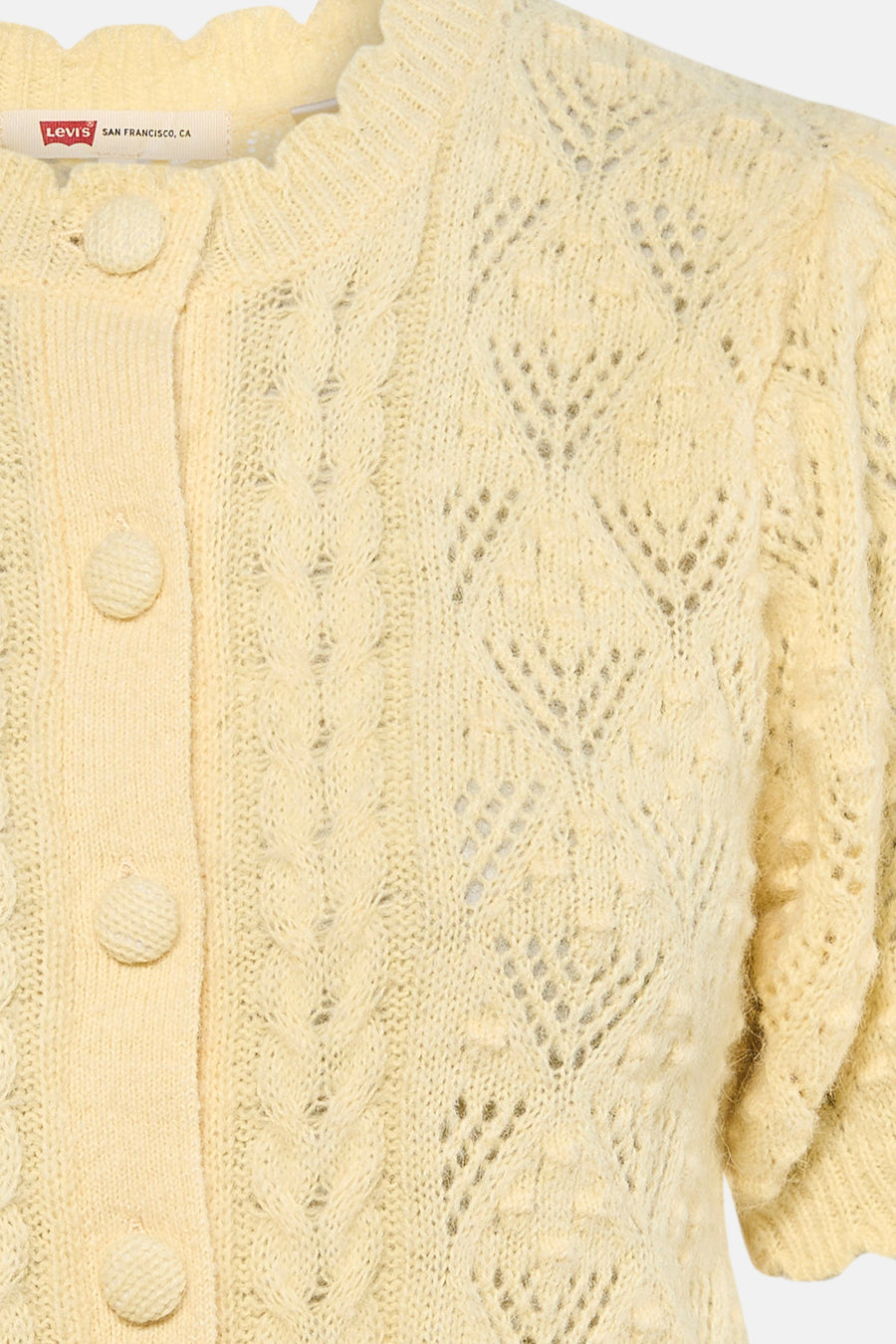 Gele gilet van Levi's, met knopen en een fijn gebreid patroon.