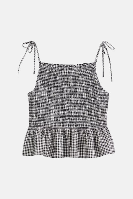 Zwarte mouwloze blouse van Levi's® met een geruite print en spaghettibandjes met strikdetails.
