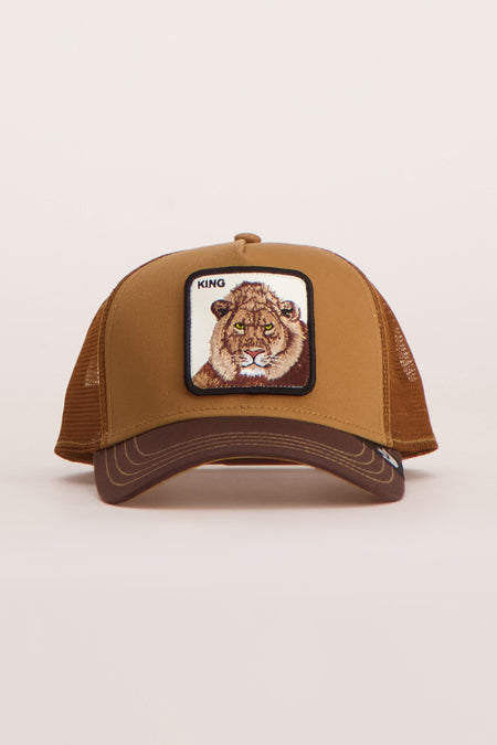 Casquette marron Goorin, avec un patch lion brodé et le texte 'KING' sur le devant.