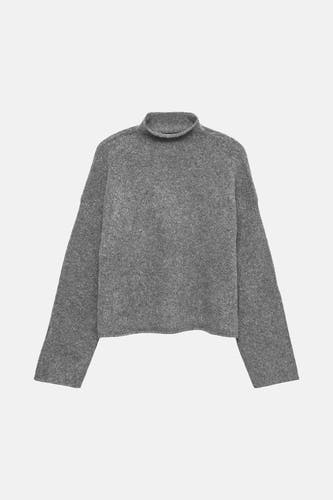 Grijze coltrui van VERO MODA®, met lange mouwen en een zachte, gebreide textuur.
