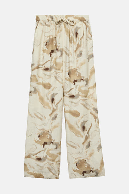 Beige broek van VERO MODA, met een abstract bloemenpatroon in bruine en grijze tinten.