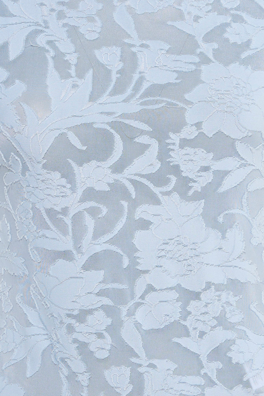 T-shirt bleu de VERO MODA® avec motif floral raffiné et texture subtile.