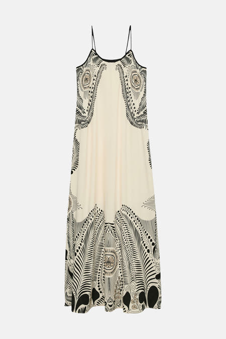 Robe sans manches écru de VERO MODA® avec un motif abstrait noir de fleurs et de feuilles.