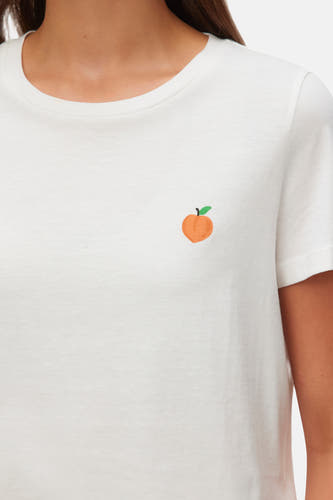 Wit T-shirt met korte mouwen van VERO MODA® met een kleine perzikprint op de borst.