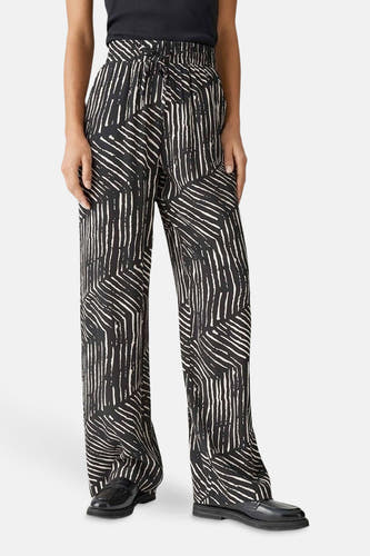 Pantalon noir OPUS avec un motif graphique noir et blanc frappant et des jambes larges.