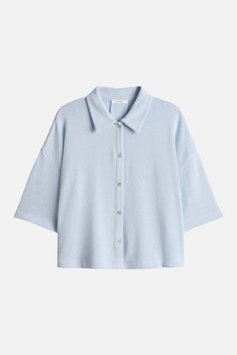 Gilet bleu OPUS à manches courtes, col et fermeture boutonnée.