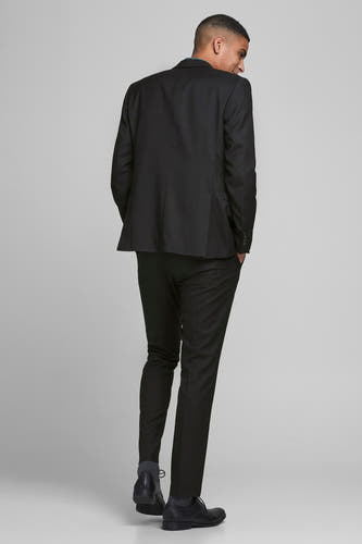Zwarte blazer van PREMIUM by JACK & JONES, gezien van achteren, met pantalon en schoenen.
