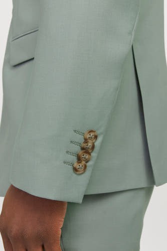 Blazer vert de PREMIUM by JACK & JONES, avec des boutons marrons sur les manches.