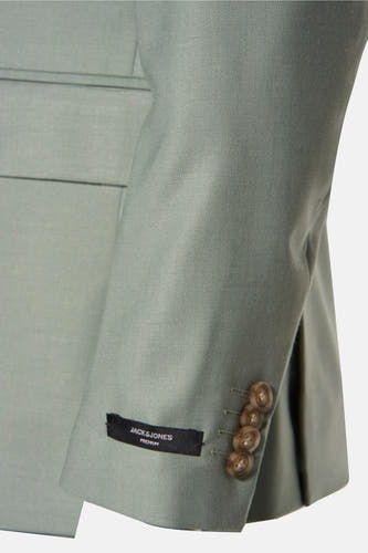 Blazer vert de PREMIUM by JACK & JONES avec fermeture à boutons et étiquette de marque sur le poignet.