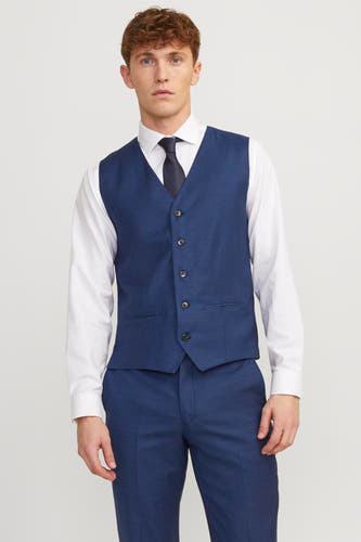 Blauw gilet van PREMIUM by JACK & JONES, gedragen met een wit overhemd en zwarte stropdas.