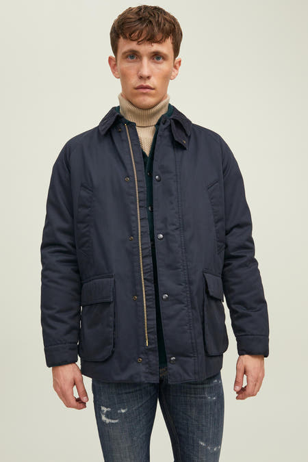 Blauwe korte jas van PREMIUM BLUE by JACK & JONES, met lange mouwen, zakken en een gouden rits.