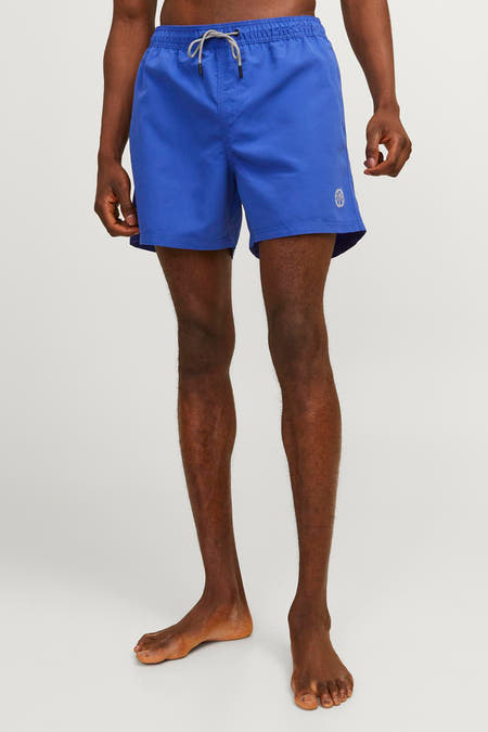 Blauwe zwemshort van JACK & JONES JEANS INTELLIGENCE, effen kleur, met trekkoord en klein logo op de pijp.