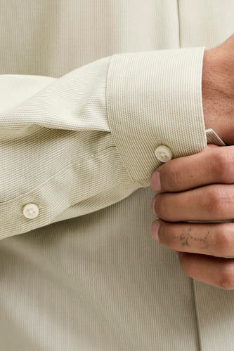 Groen overhemd met lange mouwen van PREMIUM by JACK & JONES, met een fijne textuur en een knoopdetail bij de mouw.