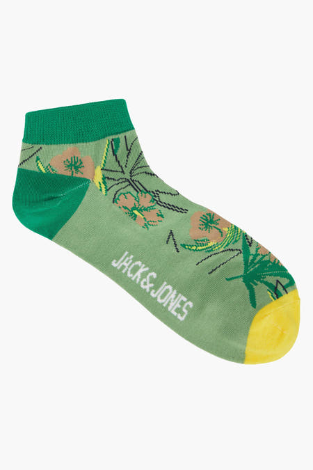 Chaussettes vertes d'ACCESSORIES BY JACK & JONES avec un imprimé de feuilles et de fleurs tropicales.