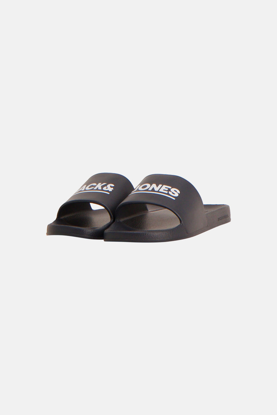 Tongs noir JACK & JONES, avec logo blanc 'LES' sur la bride et 'JACK & JONES' sur la semelle, en vue latérale.