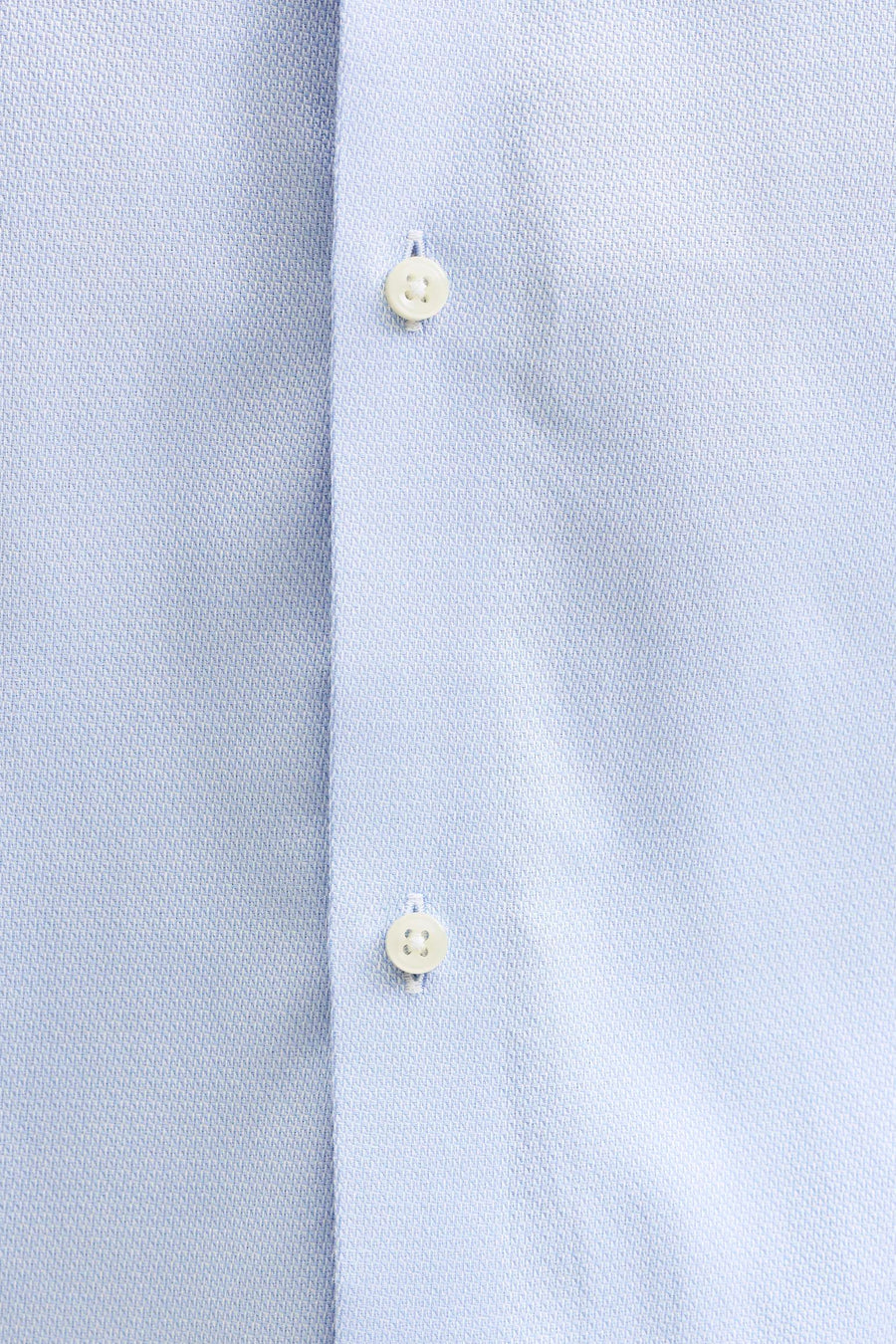 Bleu, chemise à manches longues de PREMIUM by JACK & JONES, avec une subtile texture et des boutons blancs.