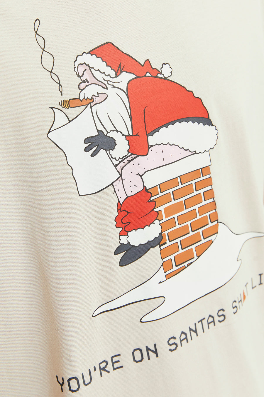 Beige T-shirt met korte mouwen van ORIGINALS BY JACK & JONES, met kerstman print en de tekst 'You're on Santa's shit list'.
