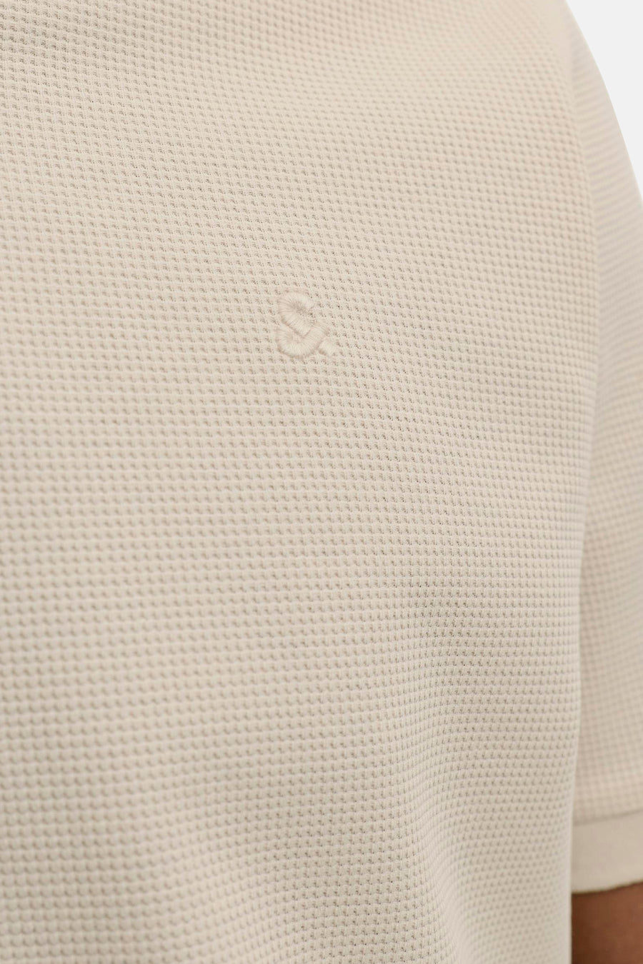 Beige polo met korte mouwen van CORE BY JACK & JONES, met wafeltextuur en geborduurd logo.