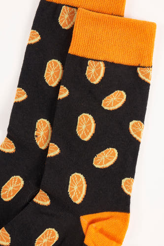 Zwarte sokken van ACCESSORIES BY JACK & JONES met een vrolijk sinaasappelpatroon en oranje accenten.

