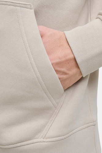 Beige sweater met kap van CORE BY JACK & JONES, met een hand in de zak en lange mouwen.
