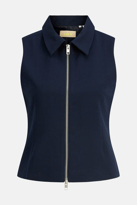 Blouse bleue sans manches JJXX avec un col et une fermeture éclair argentée.
