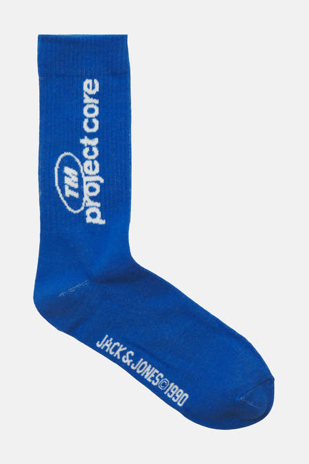 Chaussettes bleues d'ACCESSORIES BY JACK & JONES, avec des impressions de marque blanches et des logos.