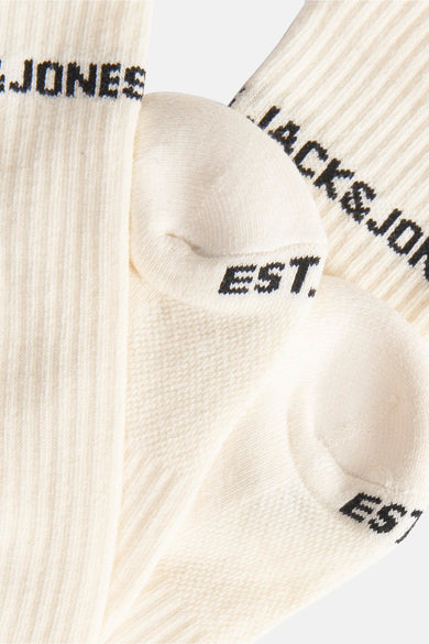 Ecru sokken van ACCESSORIES BY JACK & JONES met een ribgebreide textuur en zwarte merklogo's.