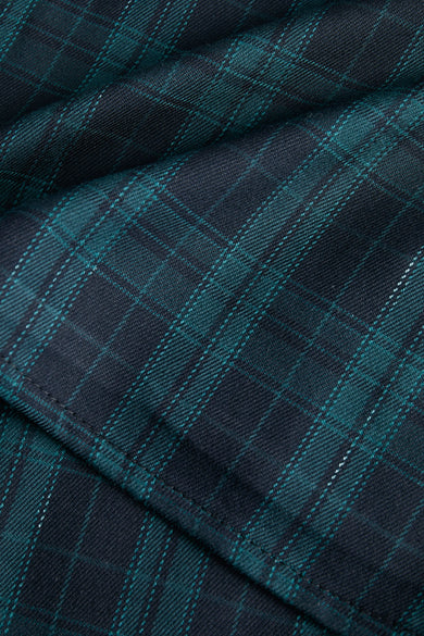 Blauwe rok van JJXX met een geruit Schots tartan patroon en plooien.
