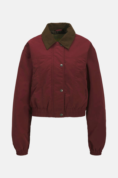 Rode korte jas van JJXX met een bruine corduroy kraag en knoopsluiting.
