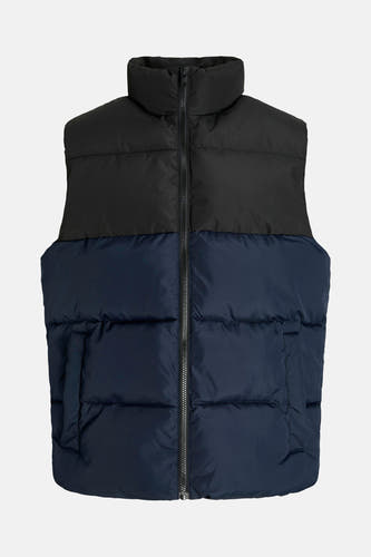 Gilet multicolore de CORE BY JACK & JONES, avec un col noir et une moitié inférieure bleu foncé, ainsi qu'une fermeture éclair.