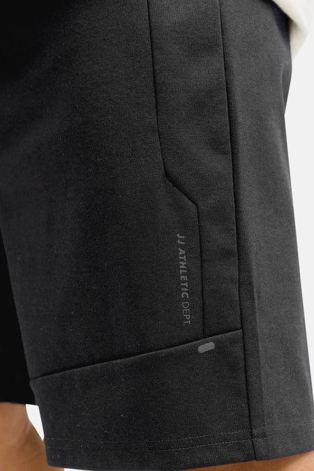 Zwarte short van JACK & JONES JEANS INTELLIGENCE, met een subtiele tekstprint op het been.