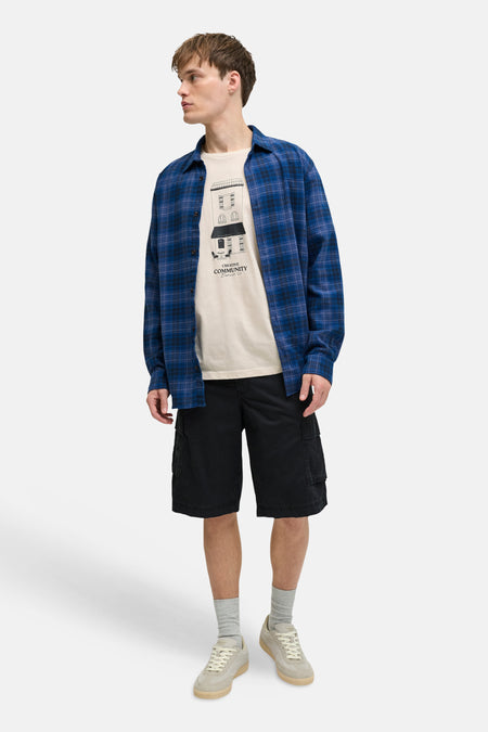 Beige T-shirt met korte mouwen van JJREBEL, met een print van een gebouw erop.