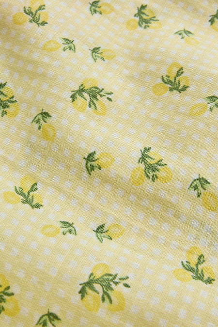 Robe jaune de JJXX avec un motif à carreaux blancs et de petits motifs de citrons.