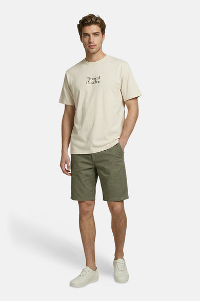 Beige T-shirt van JJREBEL met korte mouwen en "Tropical Paradise" opschrift.