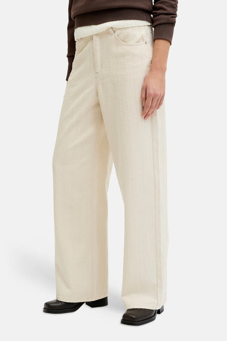 Pantalon écru JJXX avec un subtil motif à rayures verticales et jambes larges.