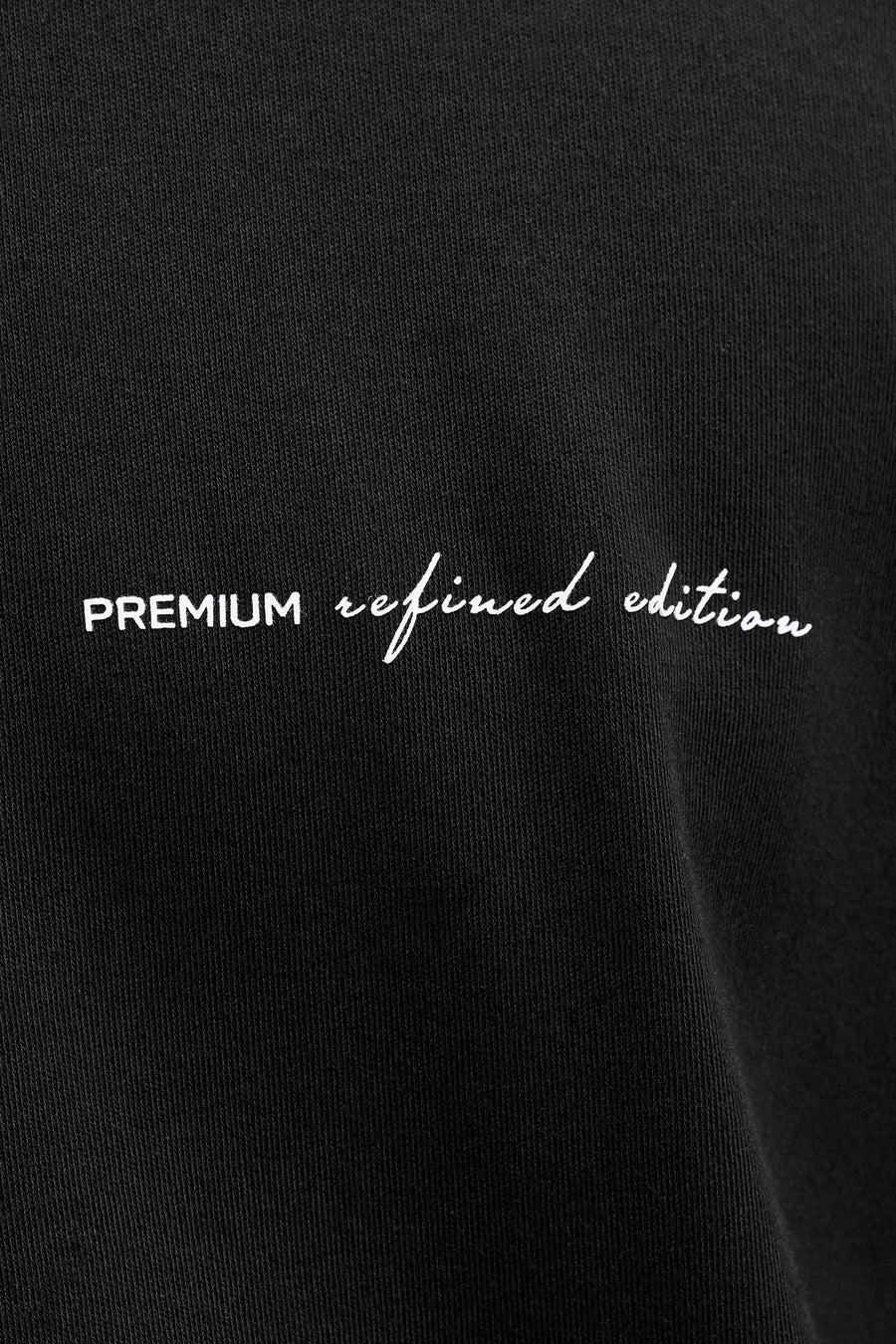 T-shirt noir à manches courtes de PREMIUM by JACK & JONES, avec un imprimé texte blanc discret.