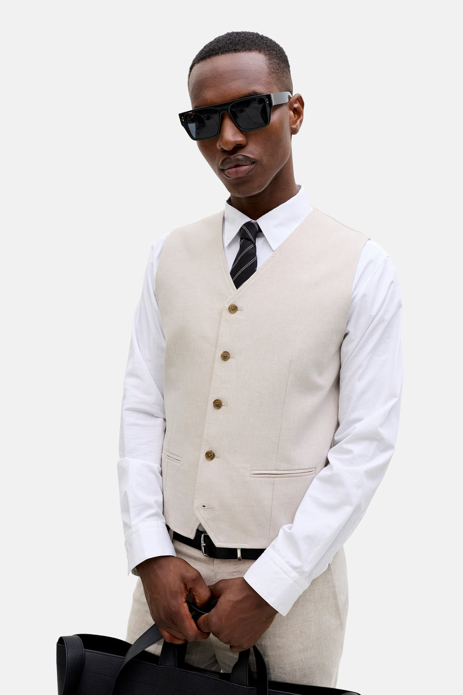 Ecru gilet van PREMIUM by JACK & JONES met knoopsluiting, zakken en een effen dessin.