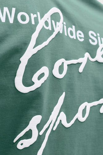 Groen T-shirt van CORE BY JACK & JONES, met witte, verhoogde tekstprint.
