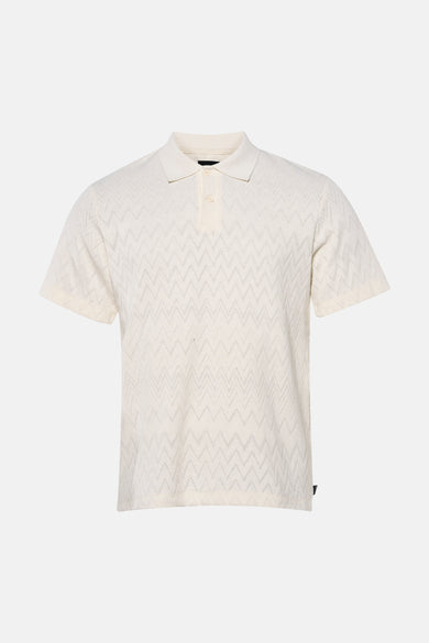 Ecru polo van PREMIUM by JACK & JONES, gebreid met een opengewerkt zigzagpatroon en knoopsluiting.