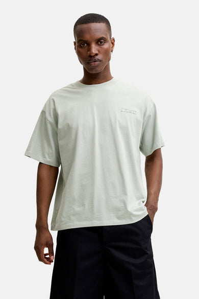 Lichtgroen T-shirt met korte mouwen van CORE BY JACK & JONES, met oversized pasvorm en subtiele tekstprint op de borst.