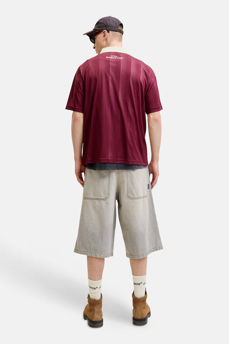 Polo rayée marron de ORIGINALS BY JACK & JONES, vue de dos, avec 'FIFA WORLD CUP' dans le dos et un col clair.