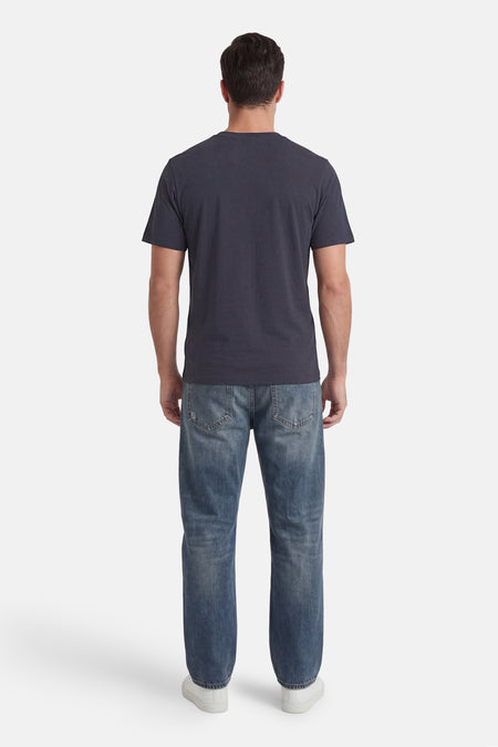 T-shirt gris de ORIGINALS BY JACK & JONES, uni et vu de dos, combiné avec un jean et des baskets blanches.