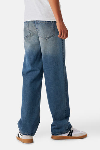 Blauwe denim jeans van LMTD, met wijde pijpen en een vervaagd kleurverloop.