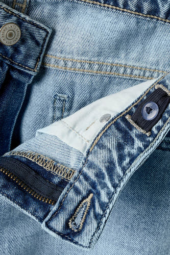 Lichtblauwe denim jeans wide van LMTD, met ritssluiting, verstelbare tailleband en een merkknop.
