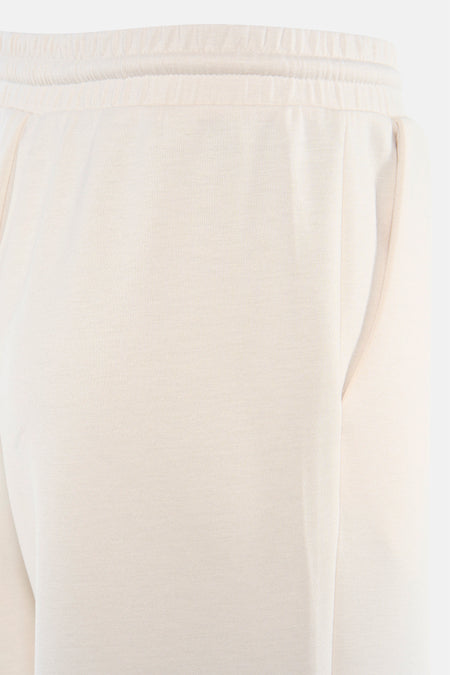 Pantalon de couleur beige de VILA, avec taille élastique et poches latérales.