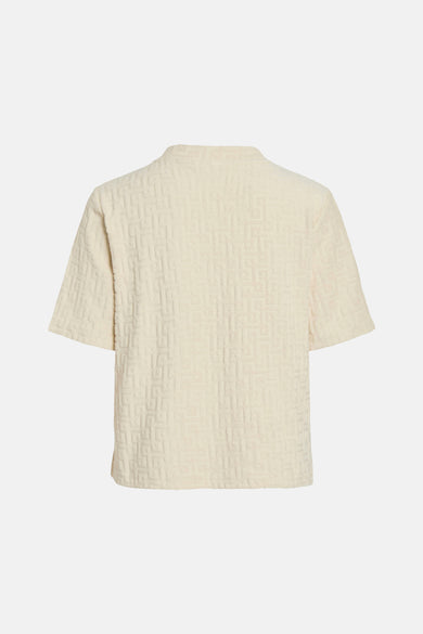 Ecru T-shirt met korte mouwen van VILA, met een geometrisch patroon en een zachte textuur.