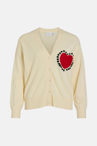Beige cardigan van VILA met een rood hart met zwarte stiksels.
