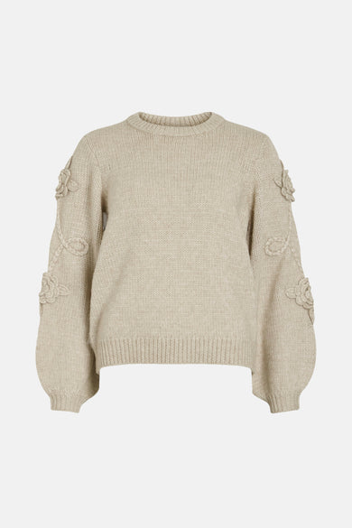 Gilet beige avec col rond de VILA, en tissu côtelé et détails floraux sur les manches.