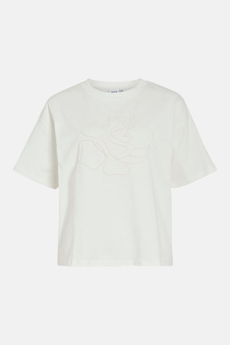 T-shirt blanc à manches courtes de VILA, avec une application subtile en forme de fleur.